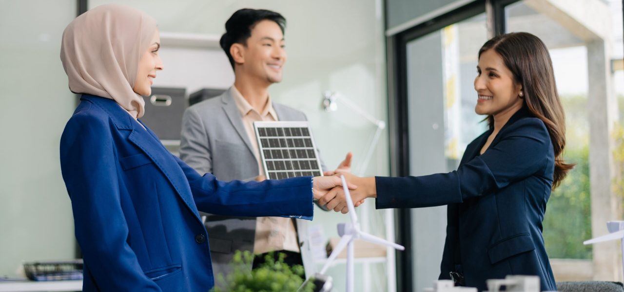 Discussion among businesspeople on the latest developments in solar cell panel technology and Solar Energy Environment city Concept.